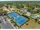 Aerial view of community tennis courts near ample parking at 2700 Nebraska Ave # 3-201, Palm Harbor, FL 34684