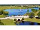 Waterway landscape aerial showcasing bridge and fountain with luxury homes at 5211 Lake Venice Dr, Wimauma, FL 33598