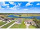 Aerial view of the home, with a large lake in the community at 5211 Lake Venice Dr, Wimauma, FL 33598