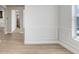 Dining room with light wood flooring, and detailed wainscoting at 5211 Lake Venice Dr, Wimauma, FL 33598
