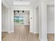 Bright, spacious foyer with modern finishes and views to the outdoor pond at 5211 Lake Venice Dr, Wimauma, FL 33598
