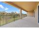 A covered balcony offers views of lush greenery and blue skies at 6307 Brevada Ln, Apollo Beach, FL 33572