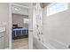 Bathroom with a shower/tub combo and view into an adjacent bedroom at 6307 Brevada Ln, Apollo Beach, FL 33572