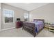 Cozy bedroom with two windows providing natural light and a comfortable bed at 6307 Brevada Ln, Apollo Beach, FL 33572