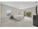 Bright, spacious bedroom with neutral tones, a large bed, and access to the balcony at 6307 Brevada Ln, Apollo Beach, FL 33572