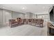 Spacious bonus room features a comfortable, oversized sectional sofa and neutral carpet at 6307 Brevada Ln, Apollo Beach, FL 33572