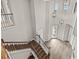 Elegant two-story foyer showcasing a wooden staircase and chandelier lighting at 6307 Brevada Ln, Apollo Beach, FL 33572
