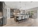 Spacious kitchen with a large center island, modern appliances, and a breakfast bar seating four at 6307 Brevada Ln, Apollo Beach, FL 33572