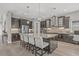 Charming kitchen showcases dark cabinetry, granite countertops, and a stylish backsplash for a modern look at 6307 Brevada Ln, Apollo Beach, FL 33572