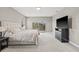This main bedroom offers neutral carpet and a private balcony through a sliding glass door at 6307 Brevada Ln, Apollo Beach, FL 33572