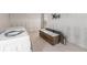 Bathroom featuring a modern wood vanity with double sinks, updated tile flooring, and natural light at 7300 Sunshine Skyway S Ln # 108, St Petersburg, FL 33711