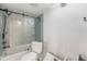Modern bathroom with a glass-enclosed shower, updated fixtures, and a tiled shower wall at 7300 Sunshine Skyway S Ln # 108, St Petersburg, FL 33711