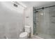 Contemporary bathroom featuring glass enclosed shower and tiled shower with modern fixtures at 7300 Sunshine Skyway S Ln # 108, St Petersburg, FL 33711