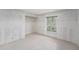 Tiled bedroom with a window that offers natural light and leads to an open closet at 7300 Sunshine Skyway S Ln # 108, St Petersburg, FL 33711