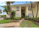 Low-rise residential apartment building with tropical landscaping and well-manicured lawn at 7300 Sunshine Skyway S Ln # 108, St Petersburg, FL 33711