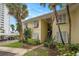 Inviting condo with tropical landscaping, shutters and stairway access at 7300 Sunshine Skyway S Ln # 108, St Petersburg, FL 33711