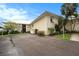 Charming condo building featuring lush landscaping and ample parking at 7300 Sunshine Skyway S Ln # 108, St Petersburg, FL 33711