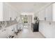 An in-progress white kitchen with sleek cabinets and modern appliances at 7300 Sunshine Skyway S Ln # 108, St Petersburg, FL 33711