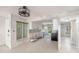 A modern kitchen with white cabinets, tile floors and appliances at 7300 Sunshine Skyway S Ln # 108, St Petersburg, FL 33711