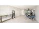 Spacious living room with tiled flooring, mirrors, and an open layout at 7300 Sunshine Skyway S Ln # 108, St Petersburg, FL 33711