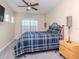 Bedroom with ceiling fan and window at 8811 Casablanca Way, Tampa, FL 33626