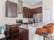 Modern kitchen features stainless steel appliances, granite countertops, and a breakfast bar at 8811 Casablanca Way, Tampa, FL 33626