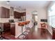 Open kitchen with stainless steel appliances, granite counters, and seating at counter at 8811 Casablanca Way, Tampa, FL 33626