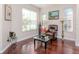 Bright living room features hardwood floors, large windows, and elegant decor at 8811 Casablanca Way, Tampa, FL 33626