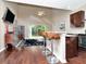 Open floorplan with kitchen, bar seating, and a living room with glass sliding doors to the patio at 8811 Casablanca Way, Tampa, FL 33626