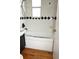 Bathroom with black and white tiles, and a white shower and tub at 11798 104Th St, Largo, FL 33773