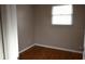 Bedroom with hardwood floors, neutral paint and a window at 11798 104Th St, Largo, FL 33773