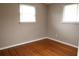 Cozy bedroom with natural lighting, wood floors and neutral paint at 11798 104Th St, Largo, FL 33773