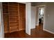 Bedroom featuring built-in closet, hardwood floors, with view to the bathroom at 11798 104Th St, Largo, FL 33773