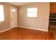 Cozy living room with wood floors and plenty of natural light at 11798 104Th St, Largo, FL 33773