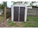 Outdoor storage shed with double doors in backyard at 11798 104Th St, Largo, FL 33773