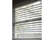 Close up of a window with horizontal blinds at 11798 104Th St, Largo, FL 33773