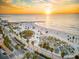 Scenic aerial view of a beach at sunset, showcasing the coastline and surrounding area at 1415 Ridge Ave, Clearwater, FL 33755