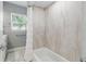 The bathroom features a shower/tub combination with white tile and a white shower curtain at 1415 Ridge Ave, Clearwater, FL 33755