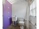 Unfinished utility bathroom shows toilet and utility sink against a white cinderblock wall at 1415 Ridge Ave, Clearwater, FL 33755
