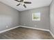 Bedroom featuring wood-look floors, ceiling fan, and neutral paint at 1415 Ridge Ave, Clearwater, FL 33755