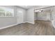 Inviting entryway with wood-look floors and a view into the open-concept living spaces at 1415 Ridge Ave, Clearwater, FL 33755