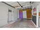 Spacious unfinished garage shows an exterior door and plenty of room for parking at 1415 Ridge Ave, Clearwater, FL 33755