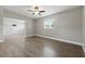 Open living room featuring wood-look floors, gray paint and a large window at 1415 Ridge Ave, Clearwater, FL 33755