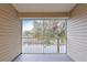 Screened lanai boasts serene views of lush greenery and a tranquil pond at 1946 Hammocks Ave, Lutz, FL 33549