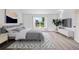 Serene primary bedroom features a large window with a picturesque outdoor view at 1946 Hammocks Ave, Lutz, FL 33549