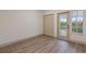 Bright, airy secondary bedroom with closet space and access to balcony at 1946 Hammocks Ave, Lutz, FL 33549