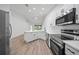 Spacious eat-in kitchen with stainless steel appliances and large windows offering natural light at 1946 Hammocks Ave, Lutz, FL 33549