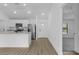 Bright kitchen features granite countertops, stainless steel appliances, and wood flooring at 1150 Huntington St, North Port, FL 34288