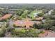 Stunning aerial view of the clubhouse and golf course surrounded by lush greenery and beautiful landscaping at 16403 Zurraquin De Avila, Tampa, FL 33613