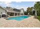Backyard with swimming pool, patio, balcony, and tropical landscaping at 16403 Zurraquin De Avila, Tampa, FL 33613